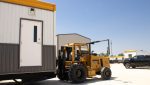 Forklift service Galveston TX with technicians repairing equipment