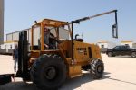Forklift service Galveston TX with technicians repairing equipment